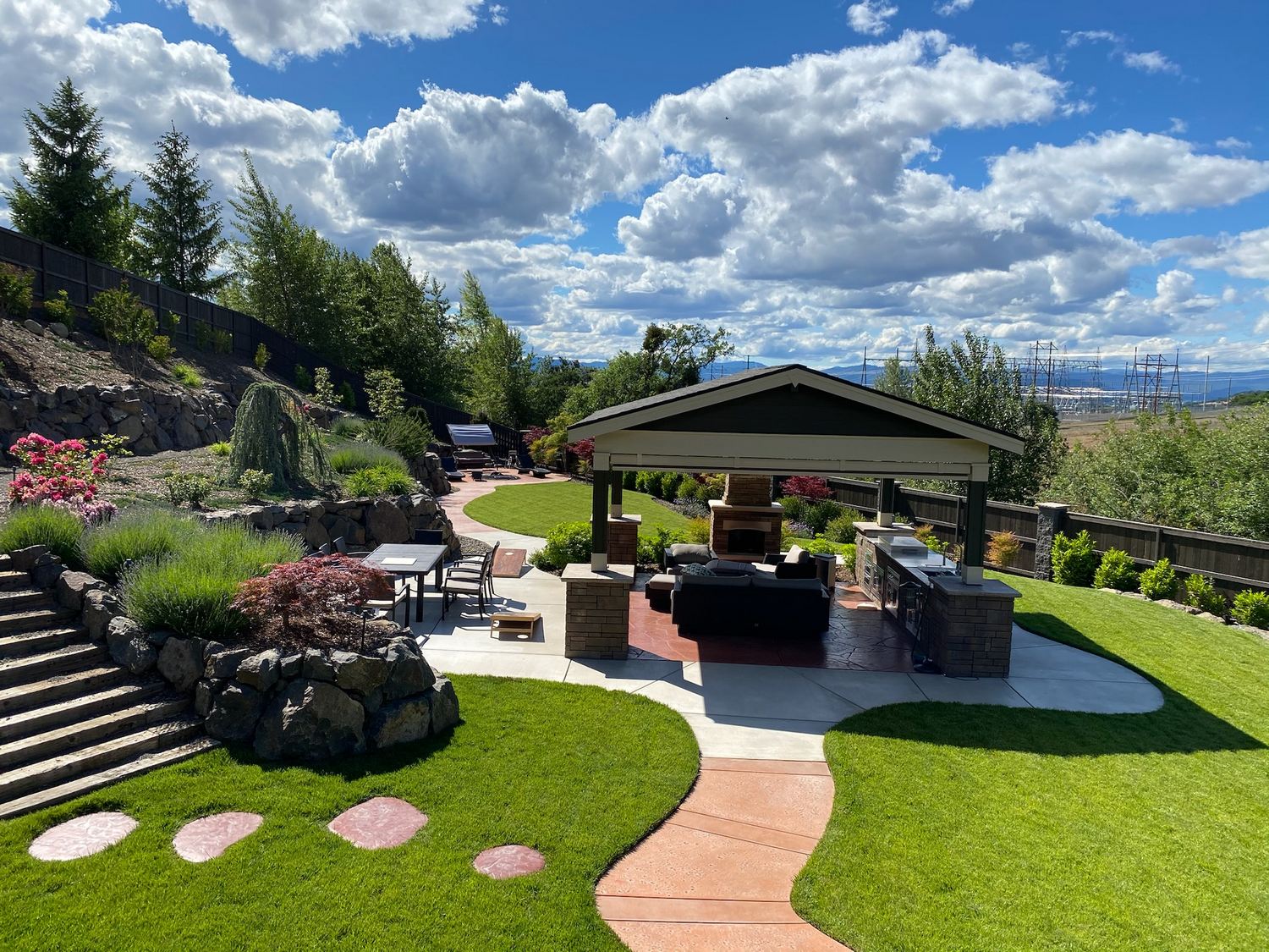 Complete Southern Oregon landscape with lawn, path, retaining walls, and outdoor living area